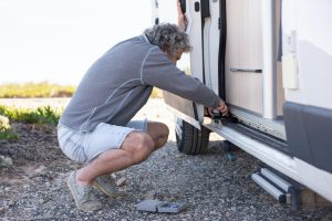 Fixing a sliding door on a camper van.