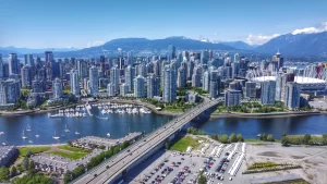  Aerial shot of downtown Vancouver, Yaletown, North Shore mountains, BC Place, False Creek and the Cambie bridge.